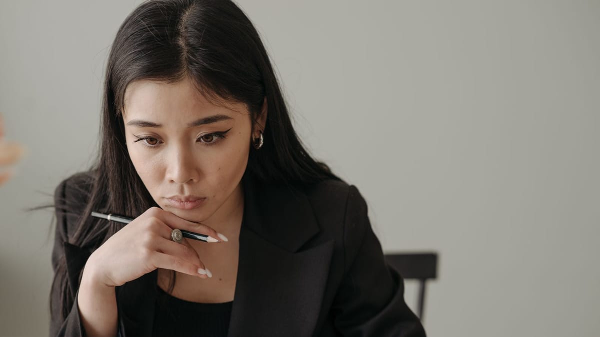 Woman reading a contract carefully before signing